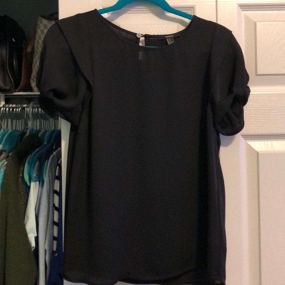 Black top with puff sleeves